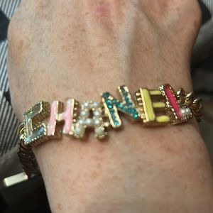 Goldtone, enamel and jeweled bracelet. Lots of fun colors! No missing stones.